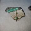 Dije de oro estrella y esmeralda.5 USD.