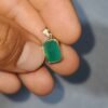 Dije masculino en oro de 18k (2.61 gramos) con esmeralda 0 USD.