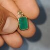 Dije masculino en oro de 18k (2.61 gramos) con esmeralda 0 USD.