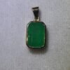 Dije masculino en oro de 18k (2.61 gramos) con esmeralda 0 USD.
