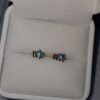 Aretes en oro de 18k con topacios azules – 1 gramo 3 USD.