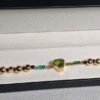 WhatsApp Image 2026-03-03 at 1.49.51 AM (2) Pulsera Peridoto esmeraldas y Rubis