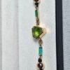 WhatsApp Image 2026-03-03 at 1.49.58 AM Pulsera Peridoto esmeraldas y Rubis